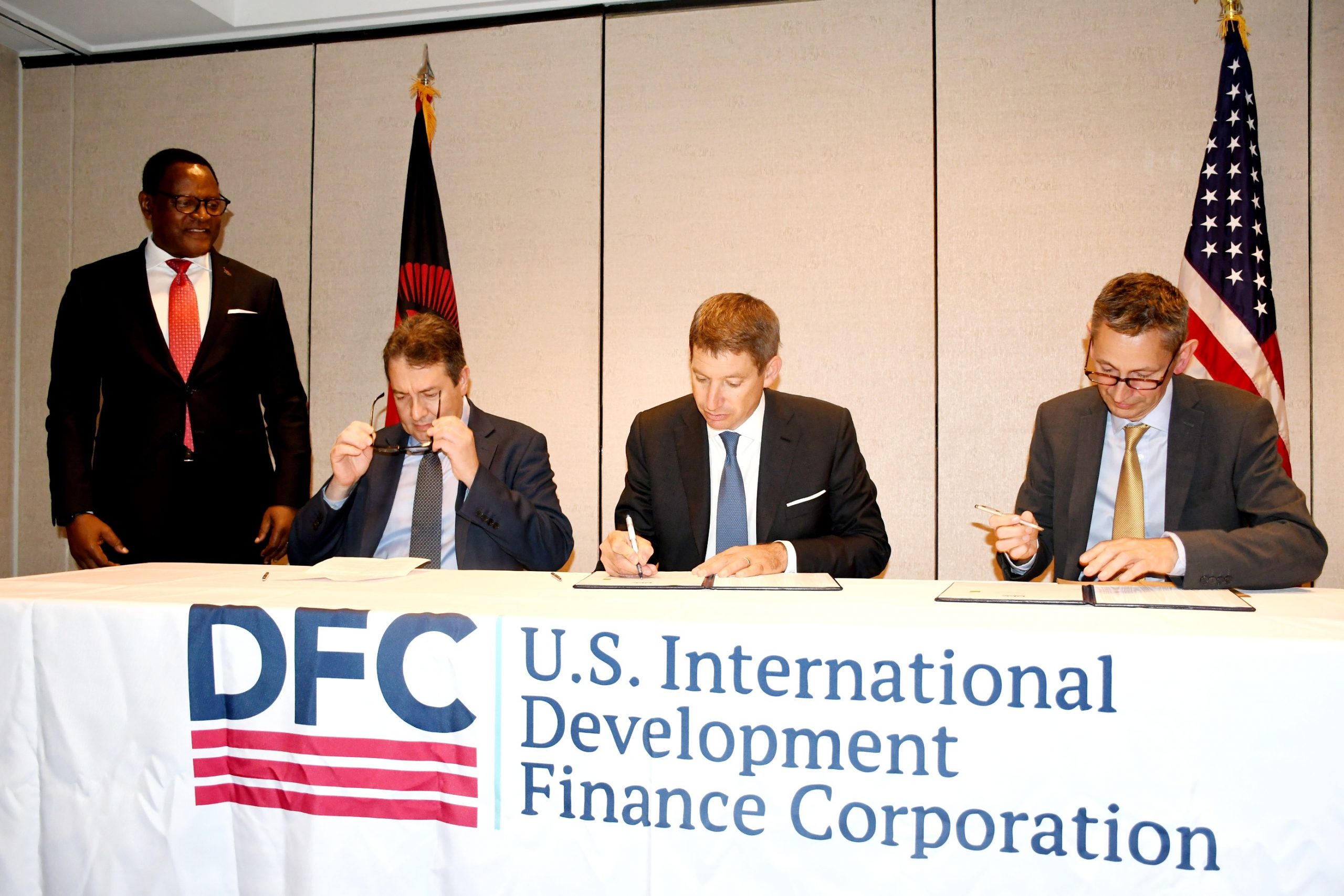 CEO for International Development Finance Corporation Scott Nathan signs the Commitment letter on behalf of US Government- by Lisa Kadango Malango
